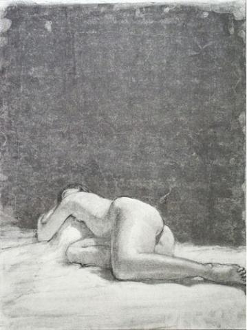 Nude woman laying on her side