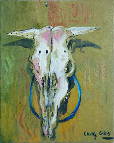Painting of a cow skull that is hung on a wall