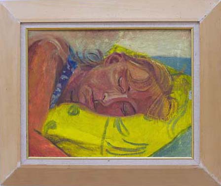 Portrait of woman sleeping with her had on a yellow pillow 