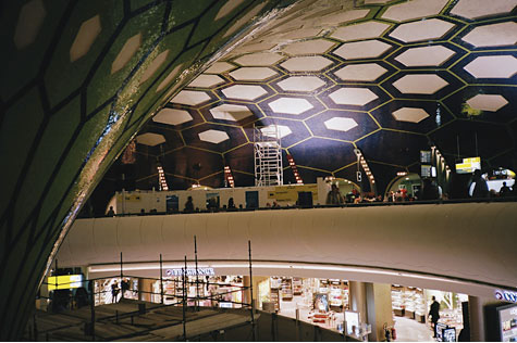 Interior photograph taken from a high point in a building capturing the circular dome ceiling and floors below