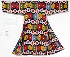 Woven Chapan, a robe for Uzbek women.  A shaped, richly embroidered robe with long sleeves