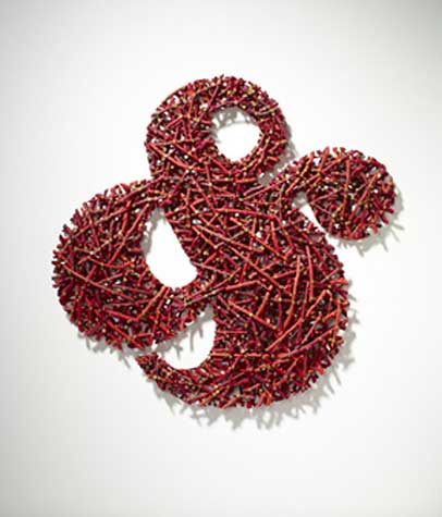 Red sculpture made from applewood paint and screws by Gyongy Laky