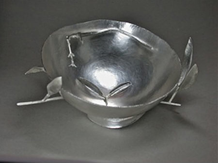 silver bowl with silver leaves and twigs  