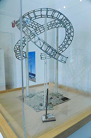 Twisted forms wrapped together, suspended above the ground.  maquette for larger piece. 