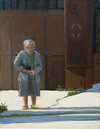 Elderly woman holding a black purse standing on a sidewalk  