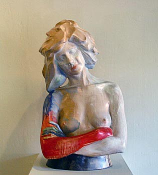 Torso of a nude woman with her arms crossed