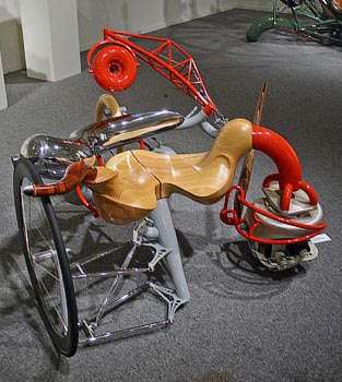 abstracted sculpture created with parts of a wheel chair and other materials