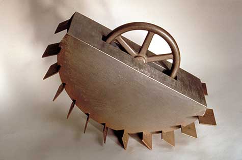 Metal sculpture of a tank with Paddles by Bella Feldman