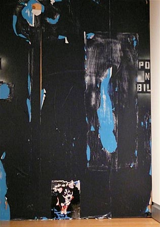 Detail of Installation.  Black wall with graffiti