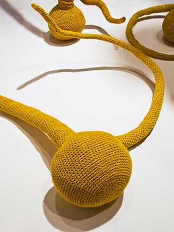 Yellow organically shaped fiber art by Esther Traugot