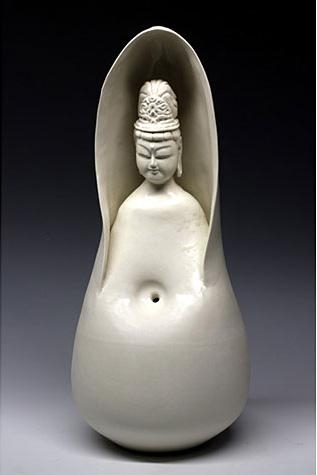 Ceramic buddha like sculpture