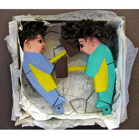 Box with two people tucked inside